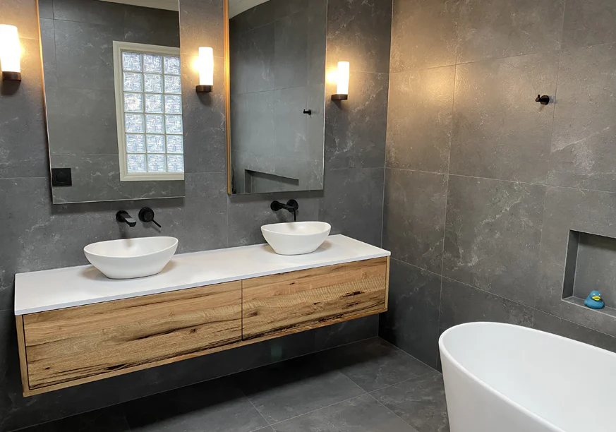 Walk-in shower with floor-to-ceiling tiling